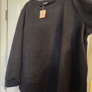 Black Textured Sweatshirt and Blue Jeans